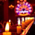 A high-resolution stock photo showcases Casino slot online bathed in warm candlelight, offering a commercial, professional quality image with flickering flames and a warm glow